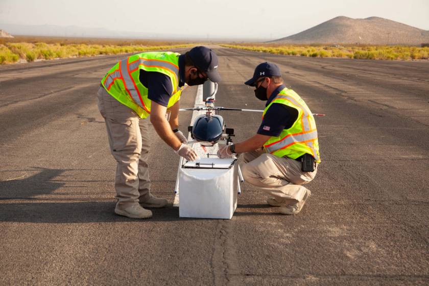 Drone and operators on the runway